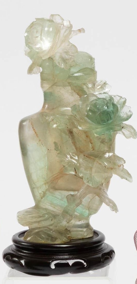 Chinese Carved Green Hardstone Vase with Floral Dd A Chinese carved green hardstone vase featuring a: A Chinese carved green hardstone vase featuring a rounded body with applied floral decoration. The piece is adorned with carved blossoms and leafy branches in high relief, showcasing detailed