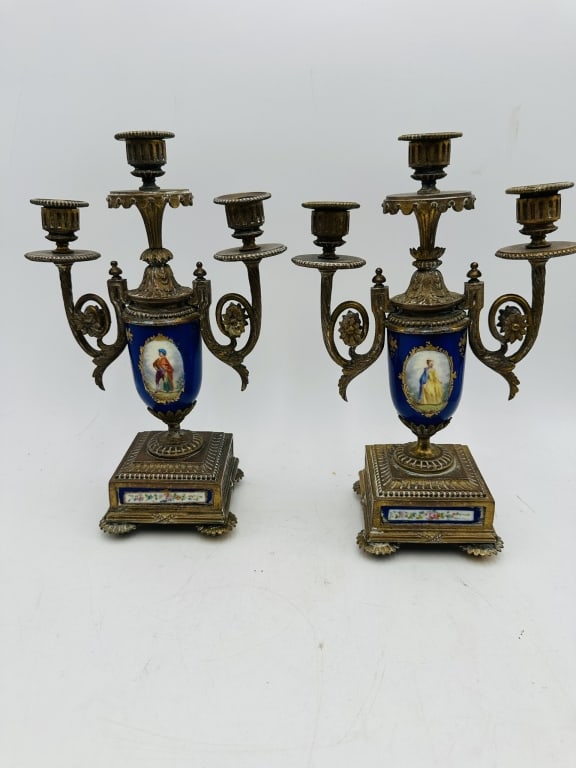Pair of French Style Gilt Bronze & Porcelain Threa An elegant pair of French-style three-light: An elegant pair of French-style three-light candelabra featuring finely cast gilt bronze mounts with cobalt blue porcelain urn-form bodies. Each porcelain reserve is decorated with hand-painted oval p