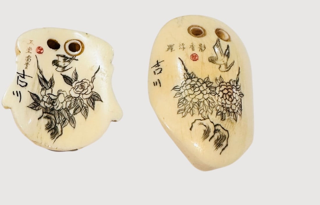 Pair of Japanese Carved Ivory Netsuke Masks Meijid A pair of Japanese carved netsuke masks, finely (1 of 3)