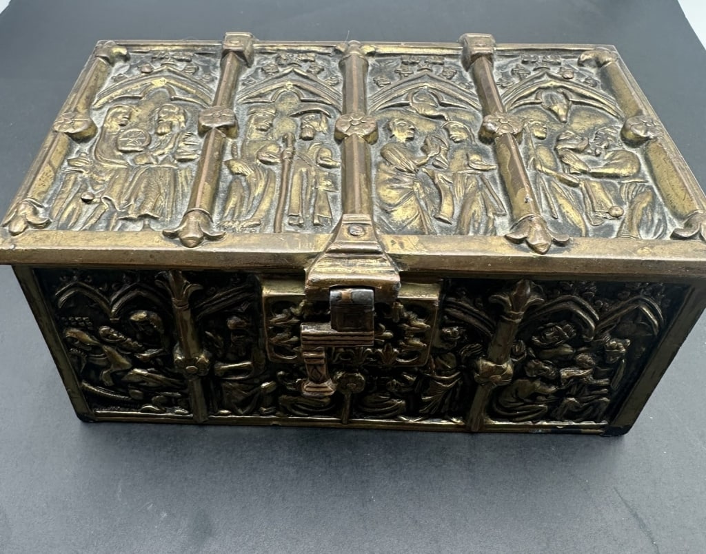Antique Gothic Revival Cast Bronze Casket with Mes Antique Gothic Revival cast bronze casket or: Antique Gothic Revival cast bronze casket or jewelry box, late 19th to early 20th century, featuring richly detailed high-relief panels depicting medieval figures beneath Gothic arches. The hinged lid