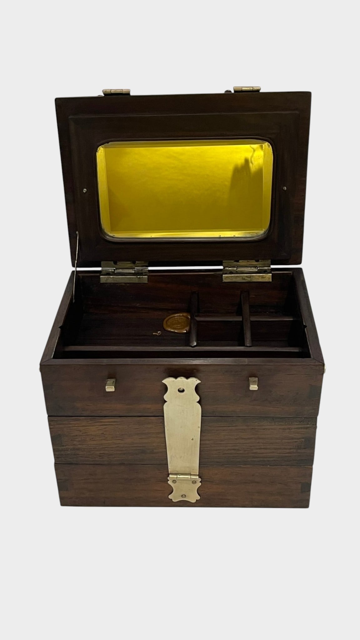 A CHINESE HARDWOOD THREE-TIER TRAVELING VANITY / S A Chinese hardwood portable vanity or jewelry box: A Chinese hardwood portable vanity or jewelry box of rectangular form, constructed with multiple hinged and tiered compartments. The upper lid opens to reveal a fitted mirror and divided storage compa