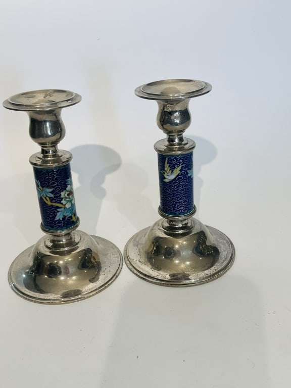 Pair of Weighted Silver-Plated and Cloisonn? Enams A matched pair of vintage or antique weighted: A matched pair of vintage or antique weighted silver-plated candlesticks featuring decorative cloisonn? enamel stem inserts.Design & Motifs: The columns are centered with vibrant blue cloisonn? enamel