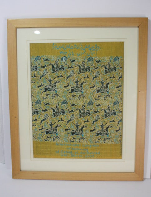 A contemporary woven gold thread panel Safavid A contemporary woven gold thread panel with Safavid: A contemporary woven gold thread panel with Safavid style battle scene and inscription commemorating International Congress of Honouring of Kamal_al_din Behzad, Iran, Tehran 2003, mounted, glazed and