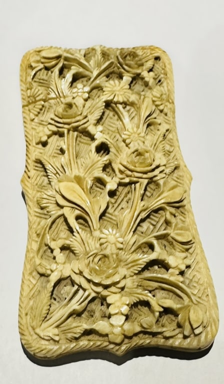 19th Carved chinese Card holder case: The front carved with floral sprays in high relief, the back decorated with two lobed cartouches containing figures in a landscape