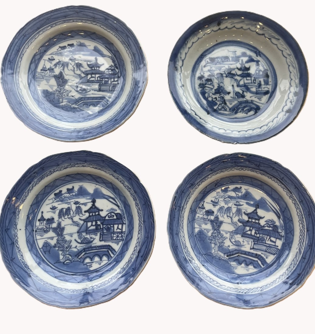 Set of Four Vintage Blue and White Porcelain Saucers / Small Plates with Willow River Landscapes: A matching set of four decorative ceramic saucers or shallow cabinet plates.Design & Motifs: Each piece is hand-painted in underglaze cobalt blue with a classic Chinese river landscape featuring tradi