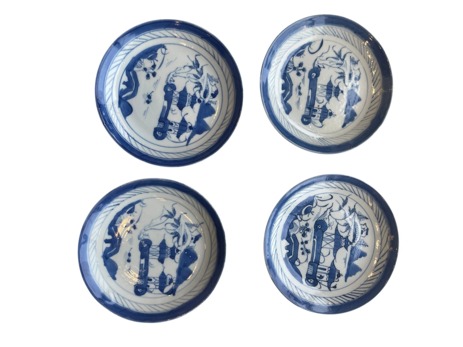 19th Set of Four Vintage Blue and White Porcelain Saucers / Small Plates with Willow River Lan: A complementary set of four decorative ceramic saucers or shallow cabinet plates matching the previous inventory. Design & Motifs: Each piece features hand-painted underglaze cobalt blue artwork depic
