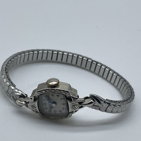 Bulova 14K Silver Watch. .5 oz: "Eve" carved on back.