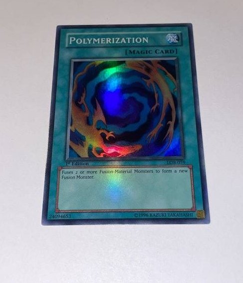 Yu-Gi-Oh! Polymerization. SUPER RARE.: 1st Edition, LOB. Magic Card. 1996 Kazuki Takahashi.