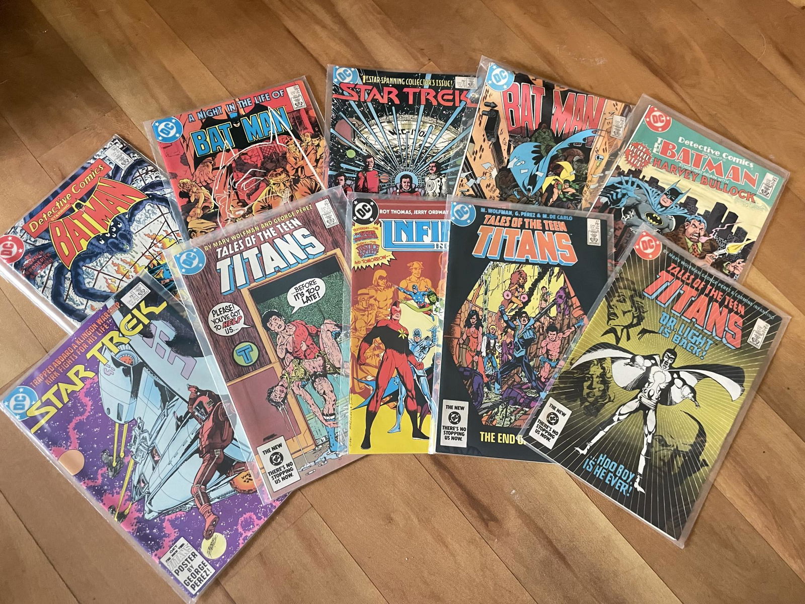 DC Comic Books! Star Trek, Tales Of The Teen Titans, Bat Man, And Infinity. (1 of 4)