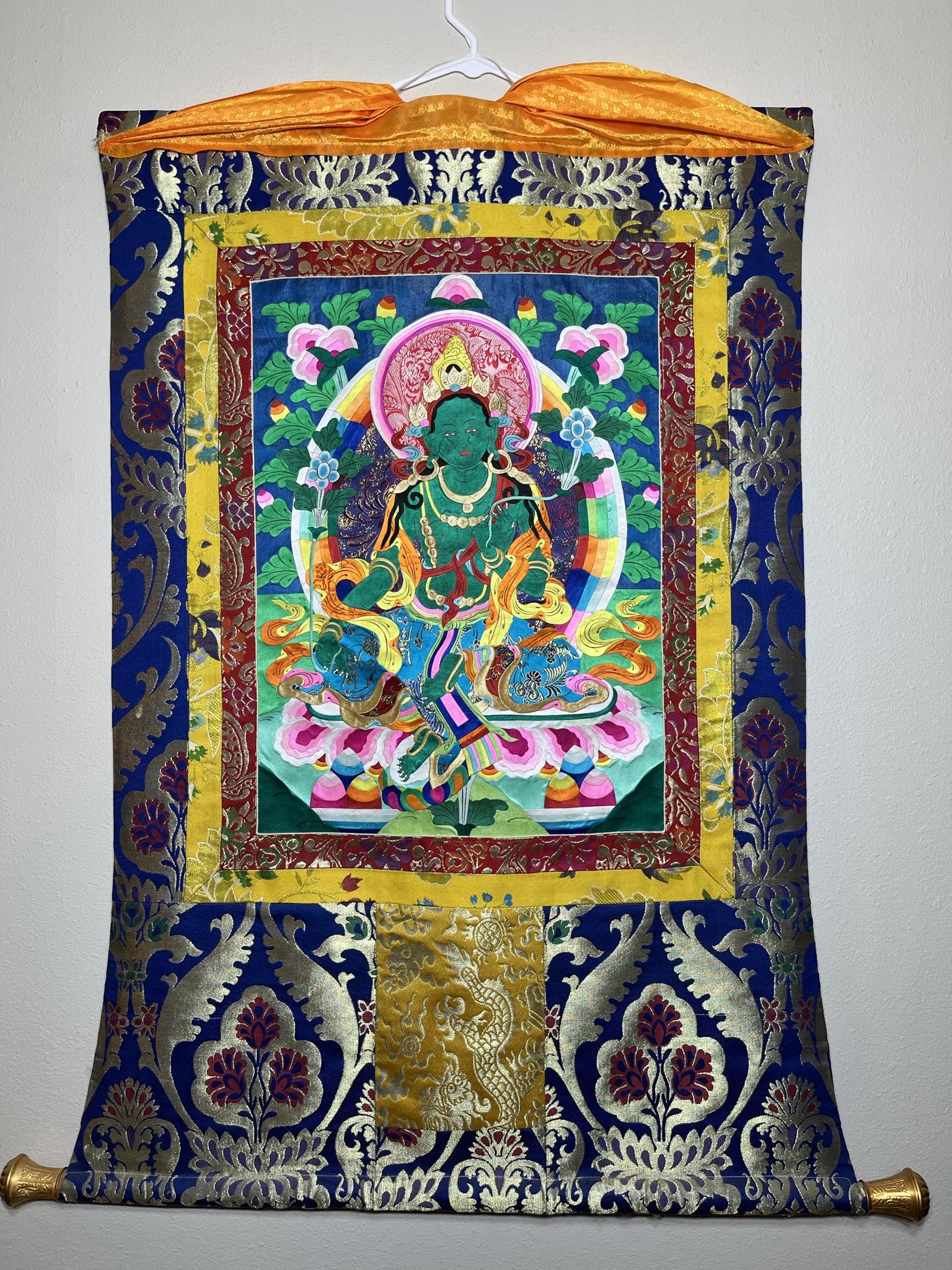 Green Tara Thangka (27in X 42in) With Cut Fabric Design In Center: Green Tara Thangka (27in X 42in) With Cut Fabric Design In Center
