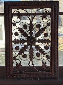 Wrought Iron Wall Hanging With A Floral And Leaf Motif