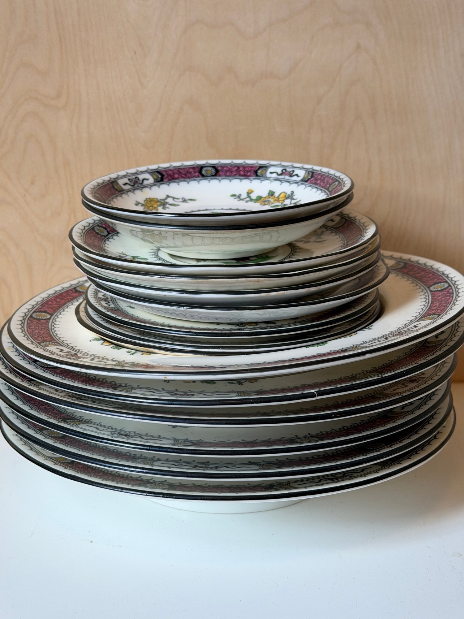 Coalport England "French-Noble" Bone China Dinnerware Set â€“ Pattern #7177/X: This fine porcelain service was produced by Coalport in Shropshire, England. The "French-Noble" pattern is a Neoclassical design featuring a vibrant pink and green scrolled border, a central pink urn