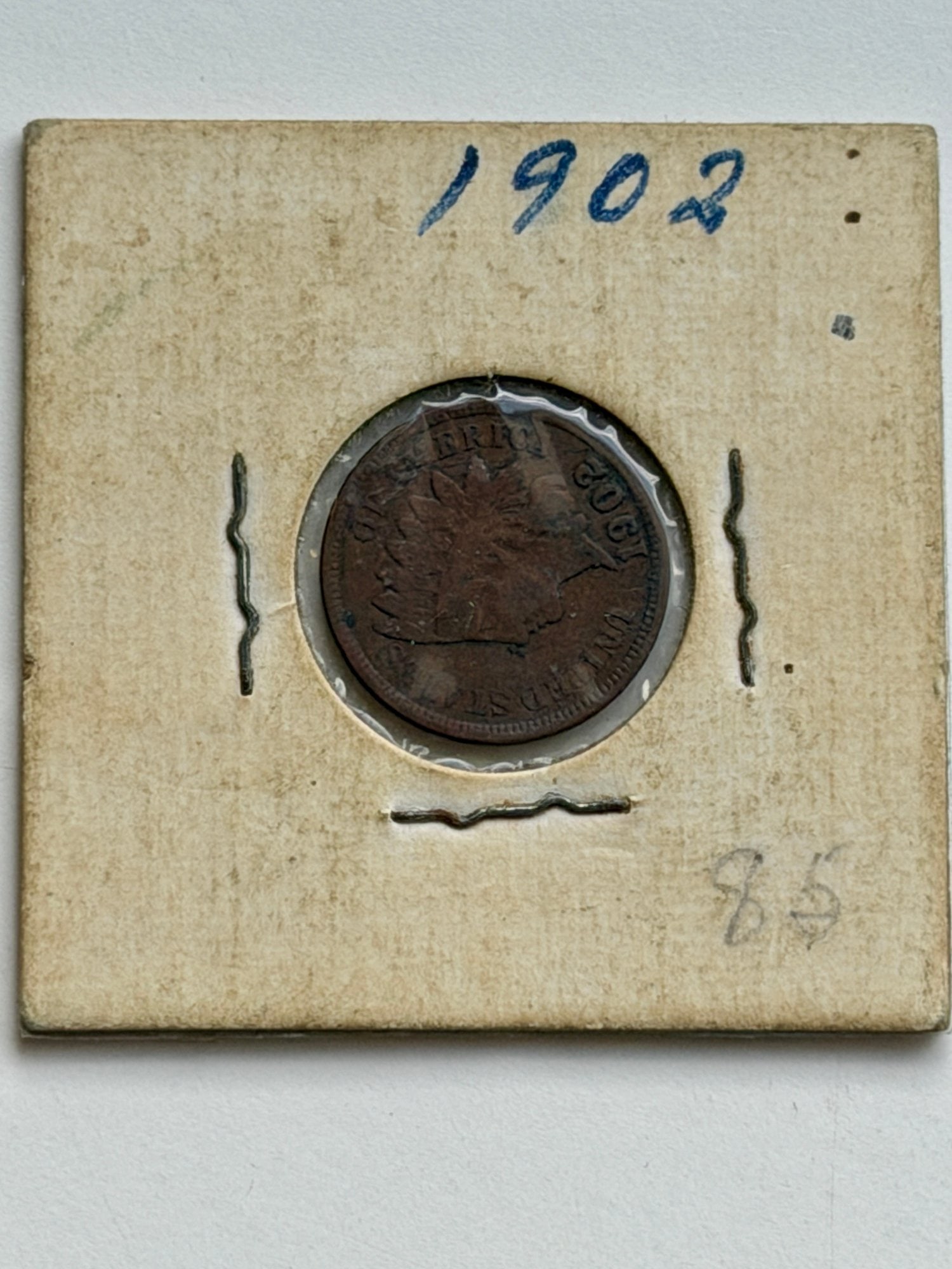 1902 United States Indian Head Penny: This 1902 Indian Head Penny represents one of the final years of the series' production. Struck at the Philadelphia Mint with a total mintage of over 87 million, this coin features Lady Liberty wearin