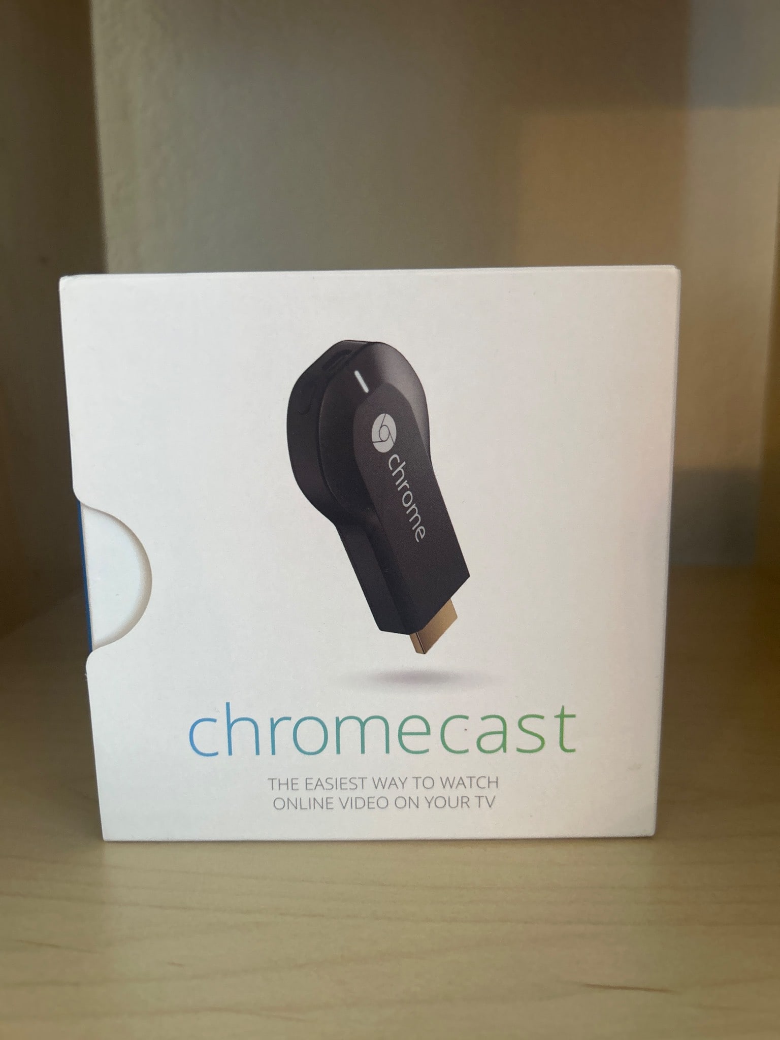 Google Chromecast 1st Generation Digital Media Streaming Device in Box: Google Chromecast 1st Generation digital media streaming device, compatible with HDMI-enabled televisions. The box includes the Chromecast device, USB power cable, and user setup guide. Designed for s