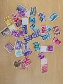 Vintage U.S. Postage Stamps in Various Colors and Denominations