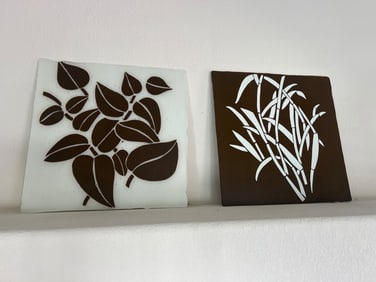 Two Decorative Ceramic Tiles with Botanical Designs