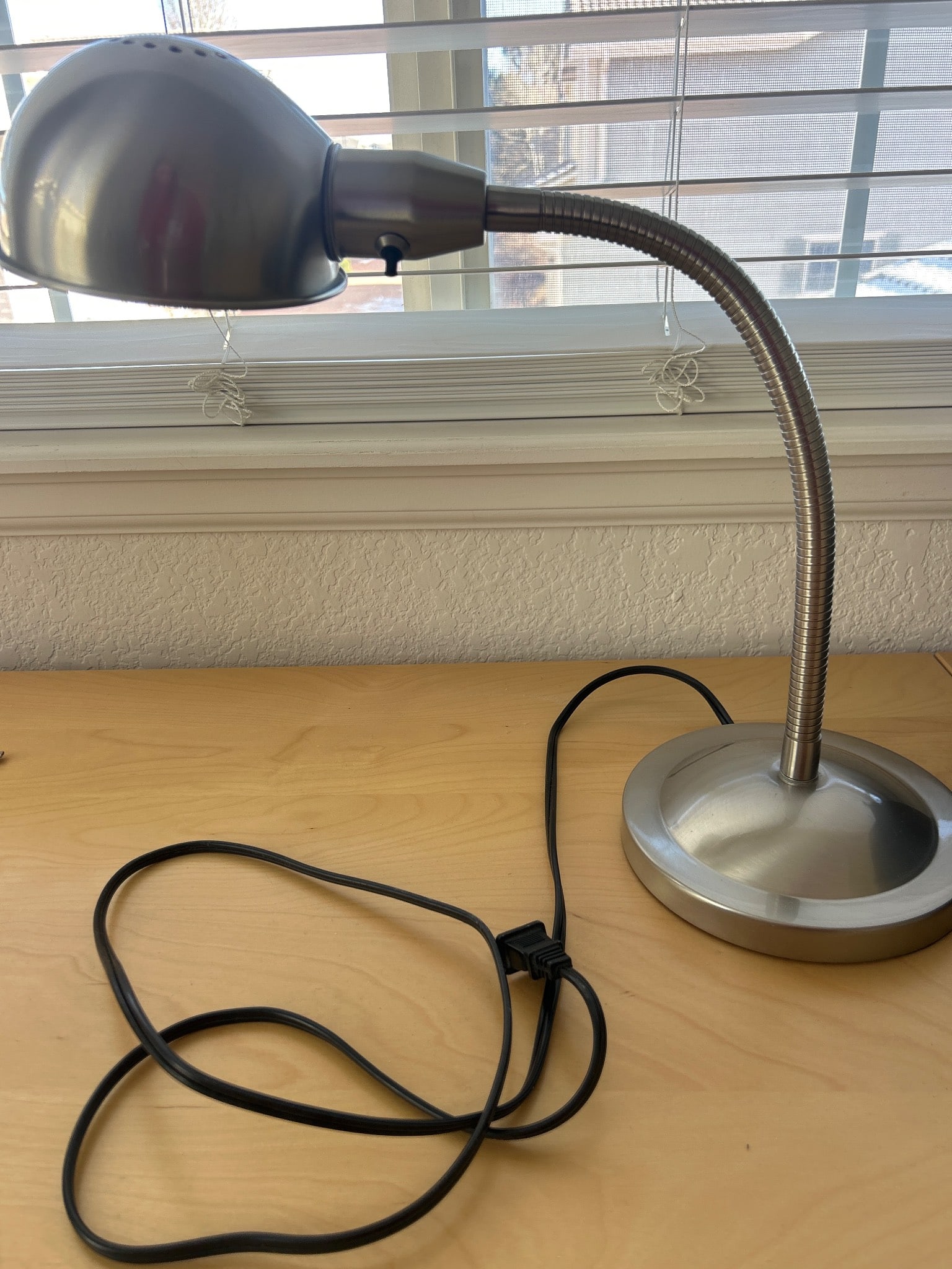 IKEA Desk Lamp with CFL Bulb and Flexible Neck: IKEA desk lamp with a sturdy base, flexible gooseneck, and metal shade. Includes a compact fluorescent light (CFL) bulb. Suitable for reading or task lighting. The base has the manufacturer's sticker 