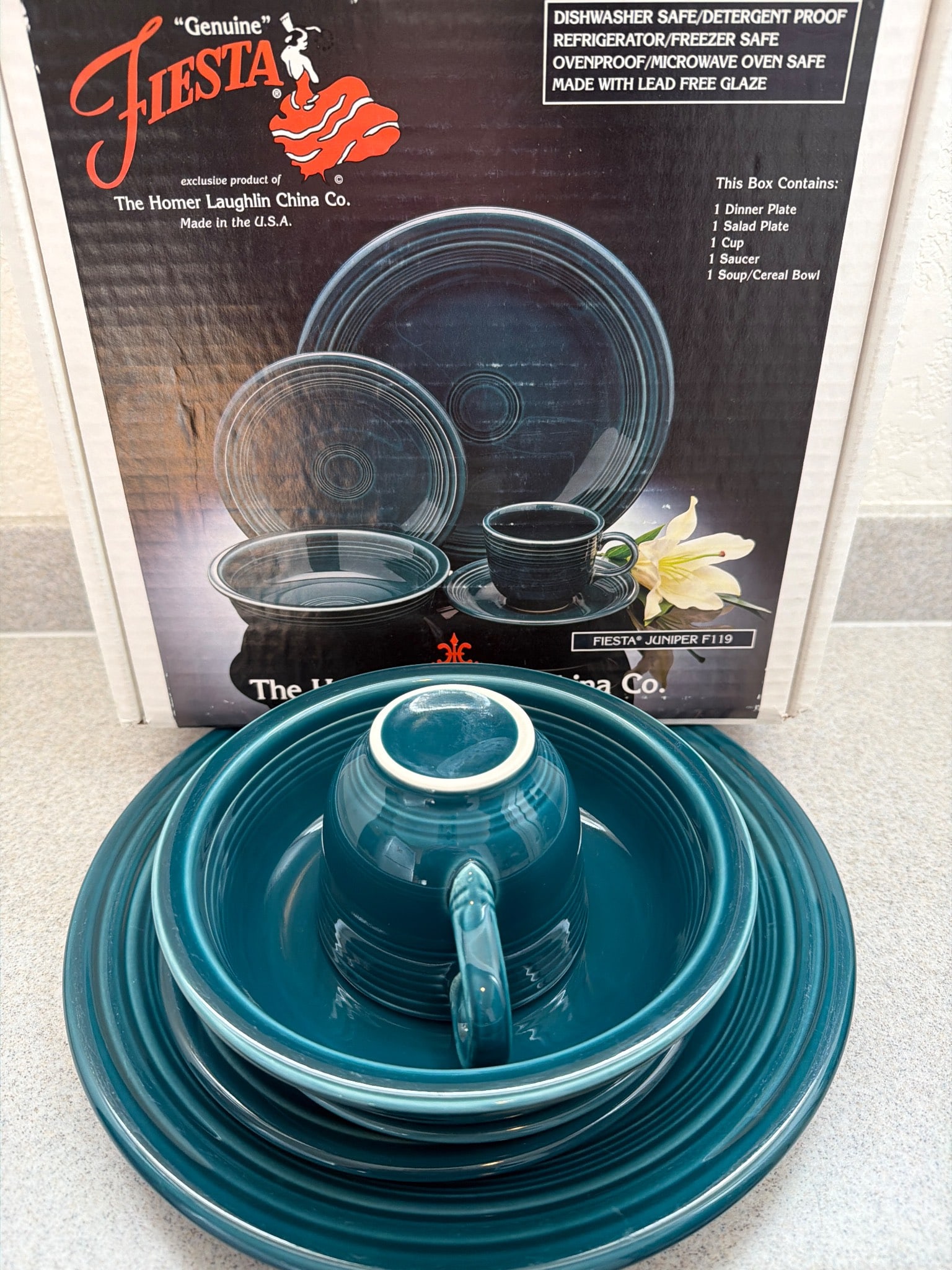 Vintage Homer Laughlin Fiesta Dinnerware Set in Teal: A vintage dinnerware set made by Homer Laughlin China Co., featuring the iconic Fiesta line in teal glaze. Includes one dinner plate, one salad plate, one bowl, one cup and one saucer. Designed to be