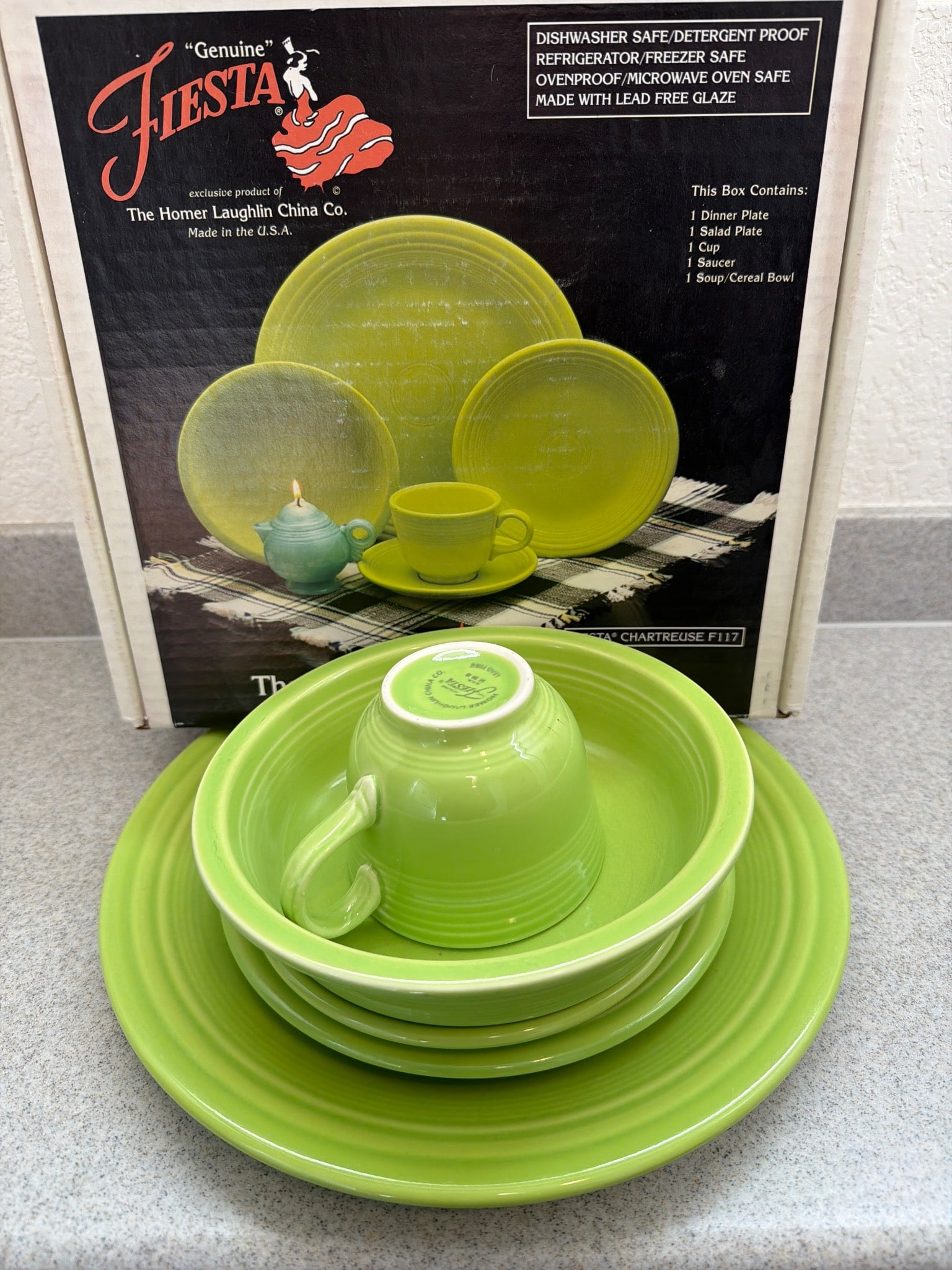 Vintage Fiesta Chartreuse 5-Piece Dinnerware Set by Homer Laughlin: A vintage Fiesta 5-piece dinnerware set in chartreuse glaze by The Homer Laughlin China Co. Includes one dinner plate, one salad plate, one soup/cereal bowl, one cup, and one saucer. The set is dishwa