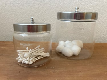 Two Pyrex Glass Storage Jars with Metal Lids