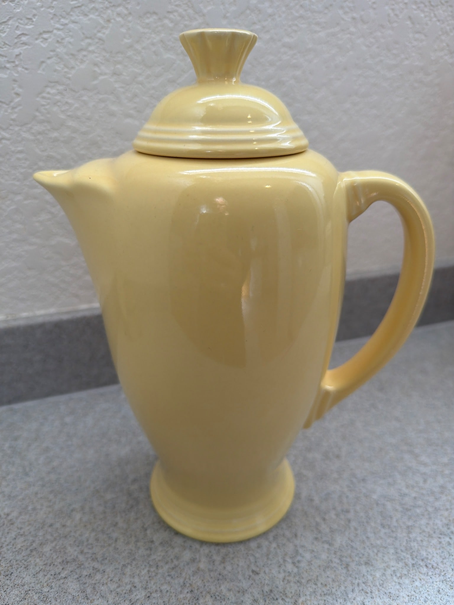 Vintage Fiesta Yellow Covered Coffee Server with Original Box: Vintage Fiesta yellow covered coffee server, marked on the bottom with 'Fiesta USA.' Made with leadless glaze, included in its original box labeled 'Color: Yellow, Pattern Number: F-106.' This item is