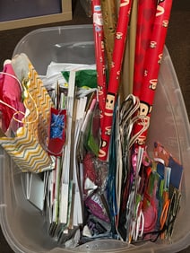 Gift Bags and Wrapping Paper in Large Plastic Storage Bin