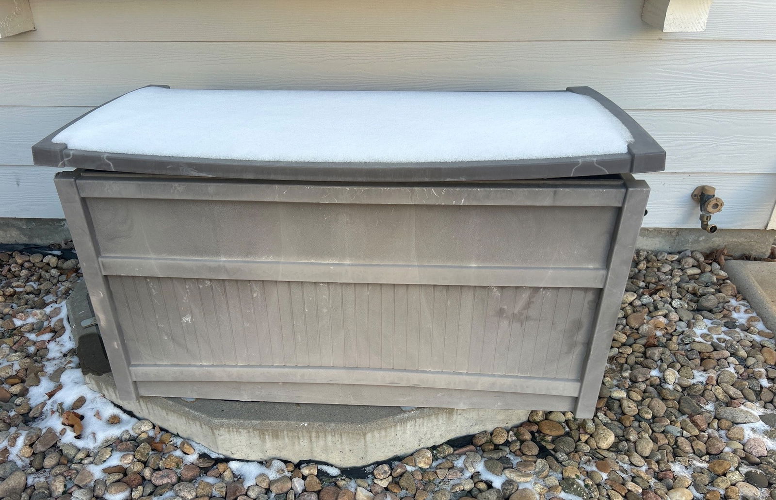 Brown Outdoor Plastic Storage Bench with Hinged Lid: Outdoor brown plastic storage bench featuring a hinged lid for convenient access. Suitable for storing various outdoor items, including gardening tools or supplies. Durable construction designed to wi