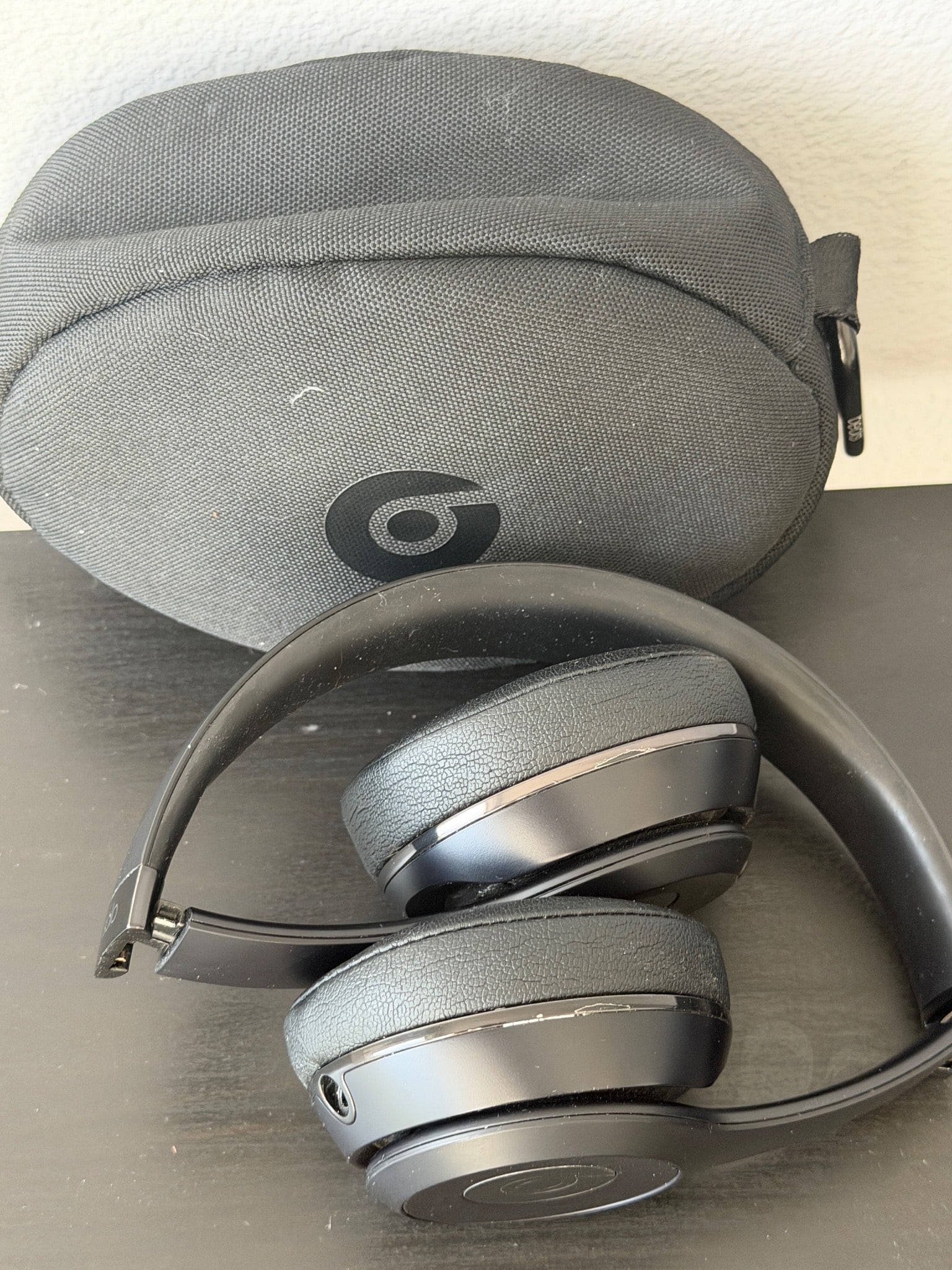 Beats By Dre Wired Over-Ear Headphones With Case: Beats by Dre wired over-ear headphones in black with matching carrying case. Designed for high-quality audio experiences. Features an adjustable headband and cushioned ear pads for comfort. Normal sig