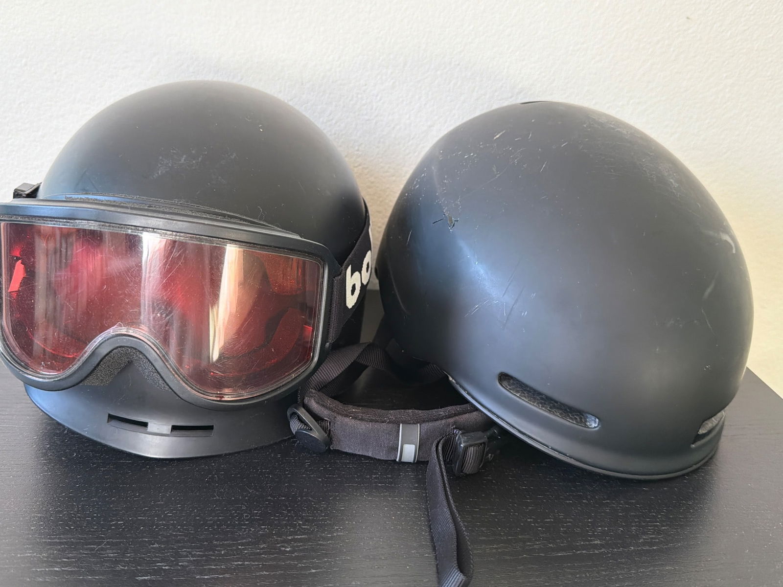 Smith Maze Helmet and Bolle Revolver Helmet with Goggles: One Smith Maze helmet (size Large, 59-63 cm) and one Bolle Revolver helmet, both in black finish. The Smith helmet is marked with its model and manufacturing information, while the Bolle helmet featur