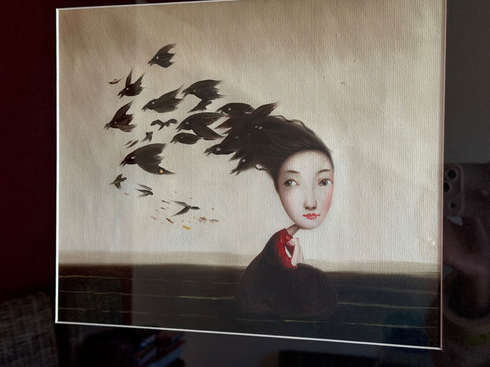 Framed Print Featuring Woman and Flying Birds by Aaron Brothers: Framed artwork depicting a woman with birds flying from her hair. The print is professionally framed under glass with a black wood frame, created for Aaron Brothers and made in Indonesia, as indicated