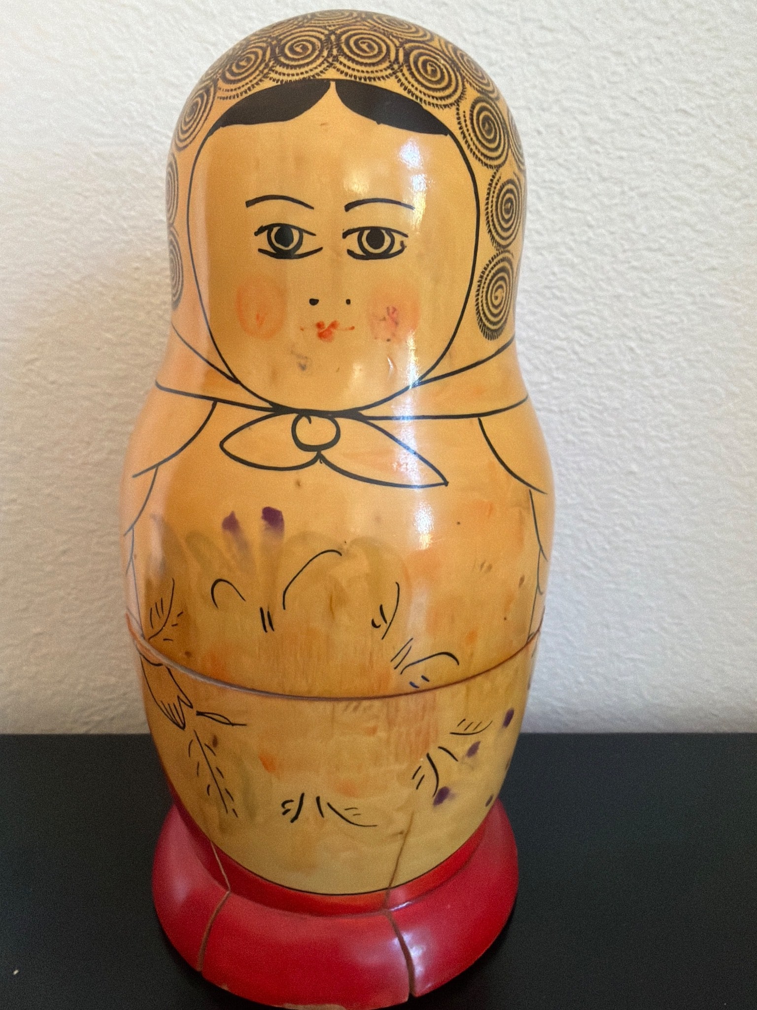 Vintage Hand-Painted Matryoshka Nesting Dolls Made in USSR: Vintage hand-painted Matryoshka nesting dolls marked 'Made in USSR' on the base. The set includes at least two dolls, featuring traditional floral patterns and facial details. Crafted from wood with v