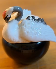 Porcelain Swan Figurine on a Glossy Black Base