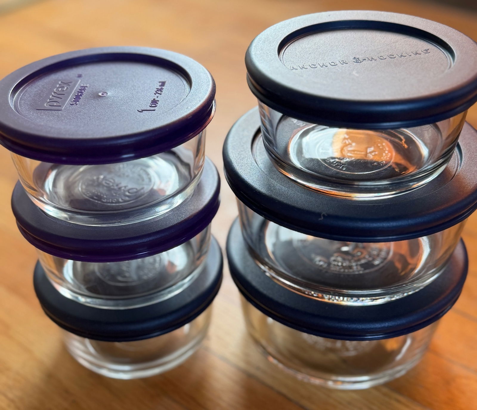 6 Pyrex Glass Storage Containers with Lids, 1 Cup (236 mL) Capacity: Six Pyrex glass storage containers, each with a capacity of 1 cup (236 mL). Includes three purple lids and three blue lids, marked 'Pyrex Storage' on the lids. Containers are made of clear glass with