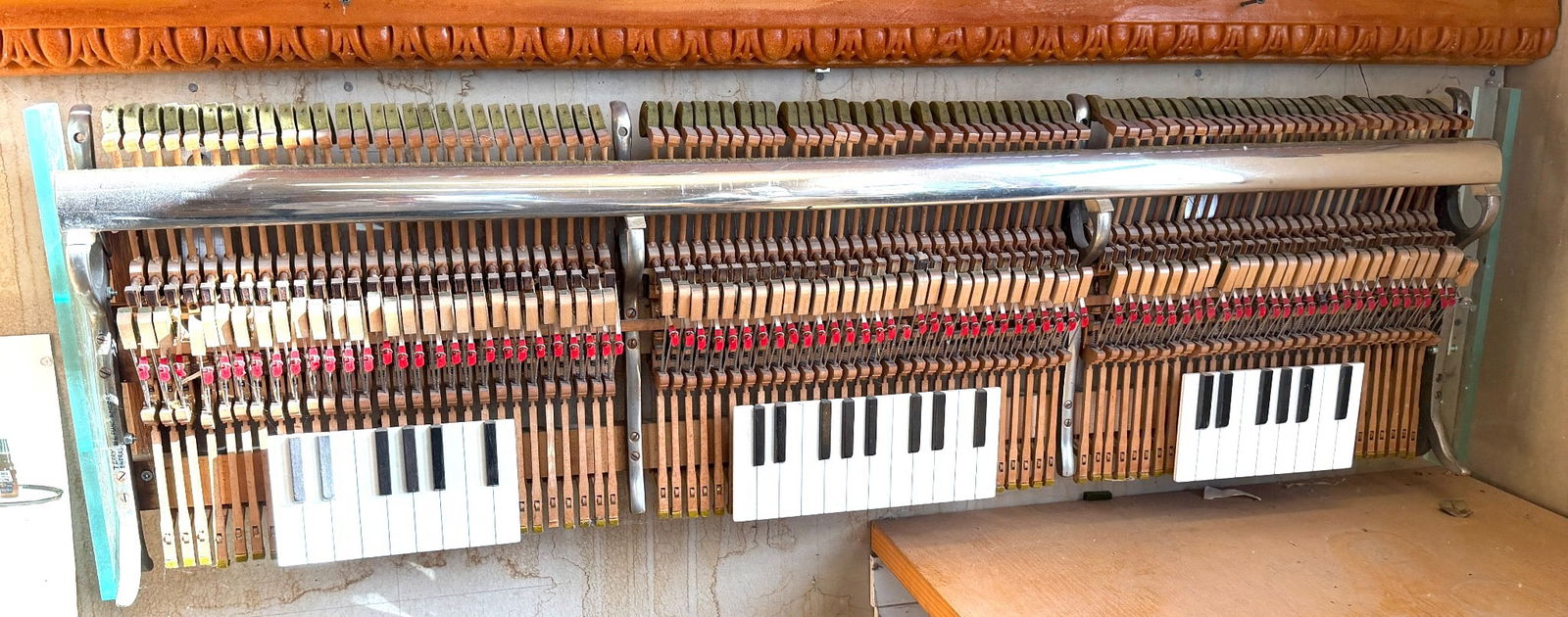 Unique Piano Key and Action Art Piece by Terry Endres #6: A custom art piece created by Terry Endres, labeled as #6 "Piano Encore." This artwork showcases repurposed piano keys and action mechanisms mounted on a wooden and glass frame. The design highlights