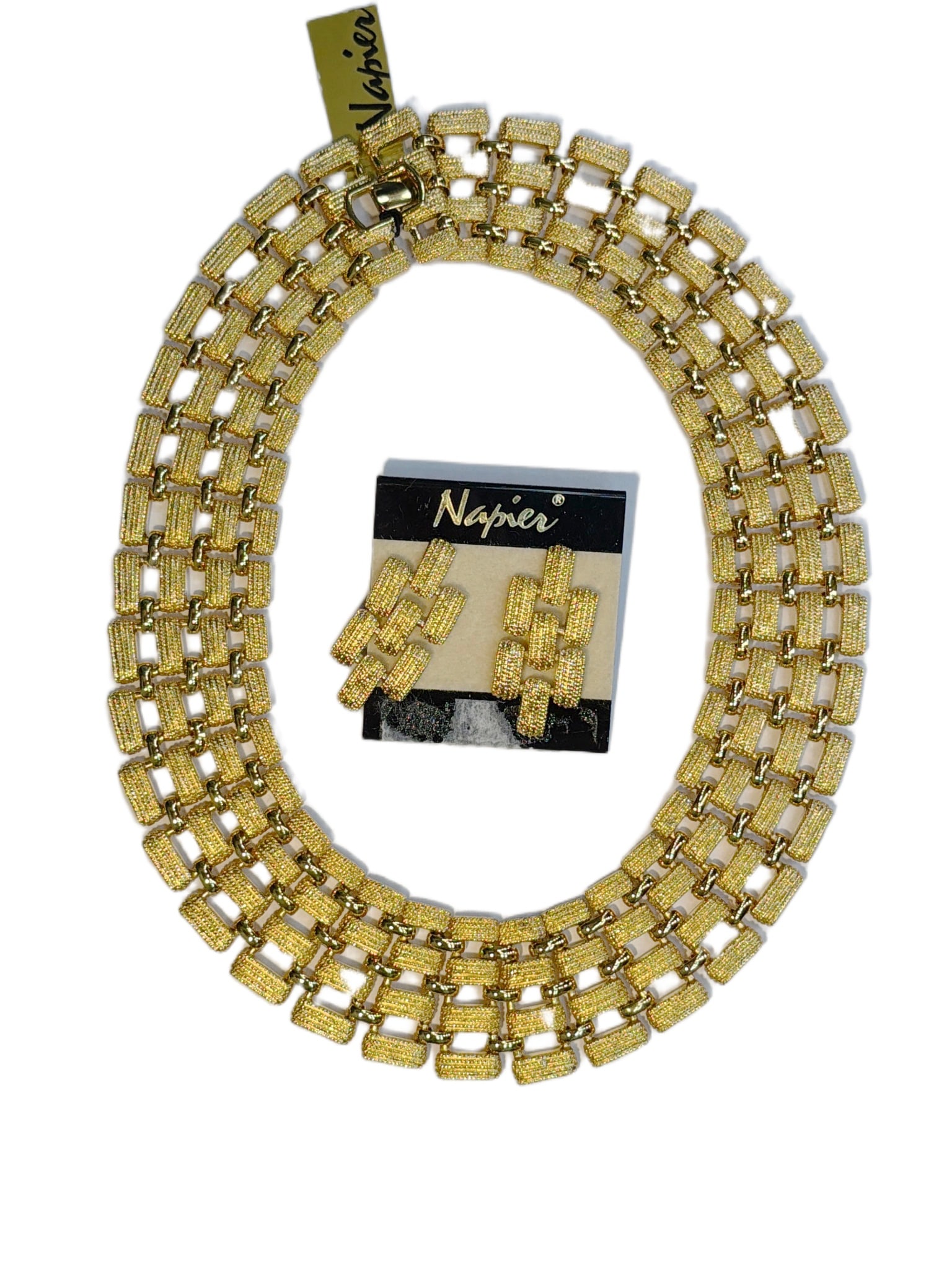 Napier Gold-Tone Necklace and Earring Set with Box: This is a Napier gold-tone jewelry set consisting of a necklace and matching earrings. Both pieces feature a repeating rectangular textured link pattern and are crafted in a gold-tone finish. The earr