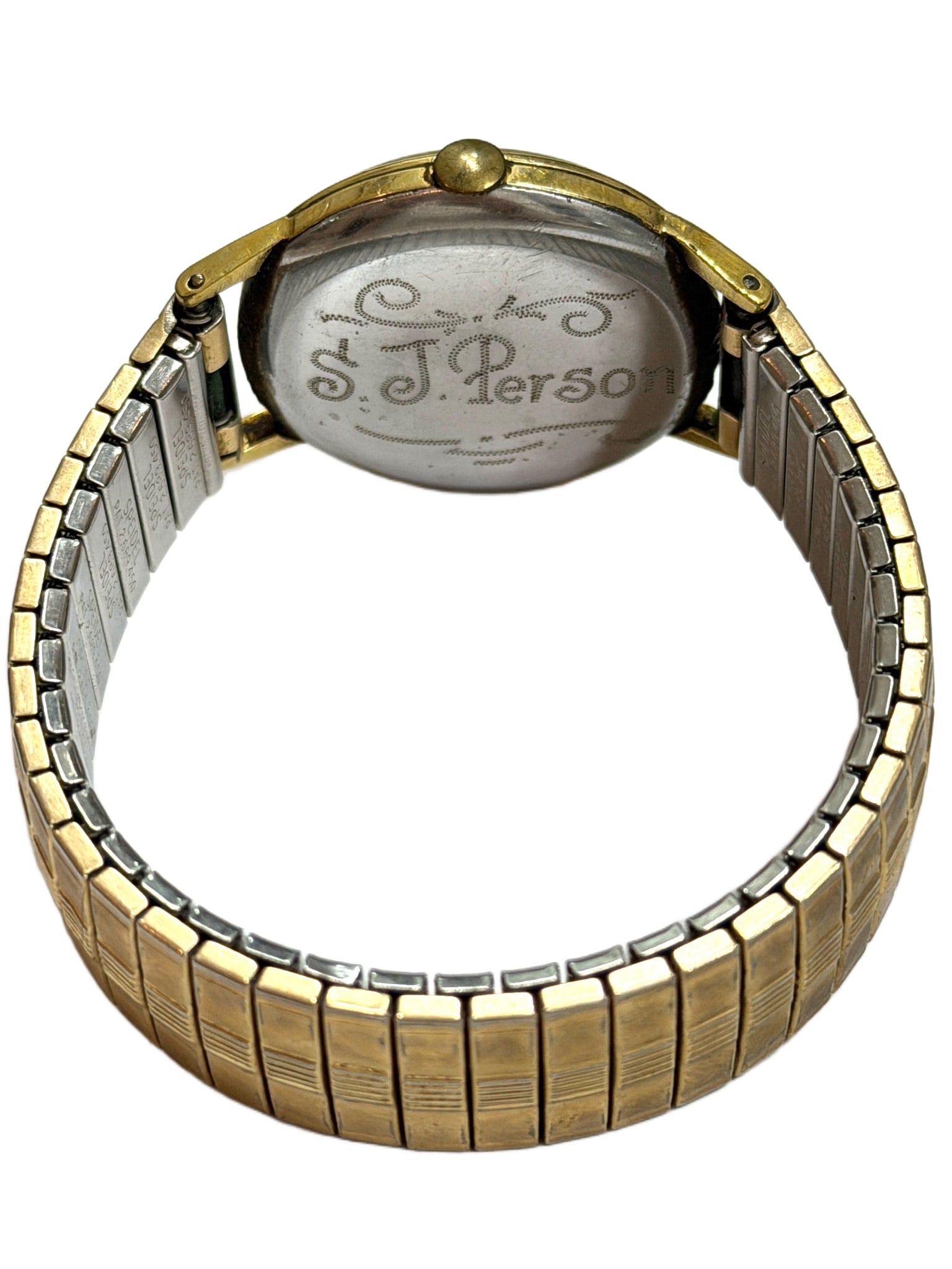 Two-Tone Stretch Bracelet Men’s Wristwatch with Engraved Caseback: Men's wristwatch featuring a gold-tone case with a round dial displaying Roman numeral hour markers. Attached is a two-tone metal stretch bracelet. The case back includes an engraved personalization.