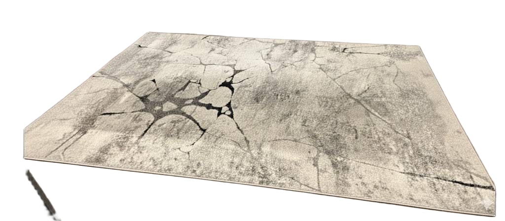 Rainier Area Rug with Black and Gray Abstract Design: Rainier area rug featuring an abstract design in shades of black, gray, and white. Manufactured from a blend of polypropylene and heat-set polyester, this rug is detailed with a dramatic 3D effect.