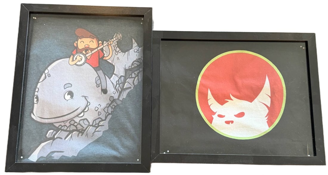 Two Framed Graphic Art Prints Featuring Figures and Creatures (1 of 2)