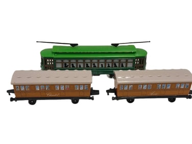 Three Die-Cast Model Trains Including Streetcar and Passenger Cars