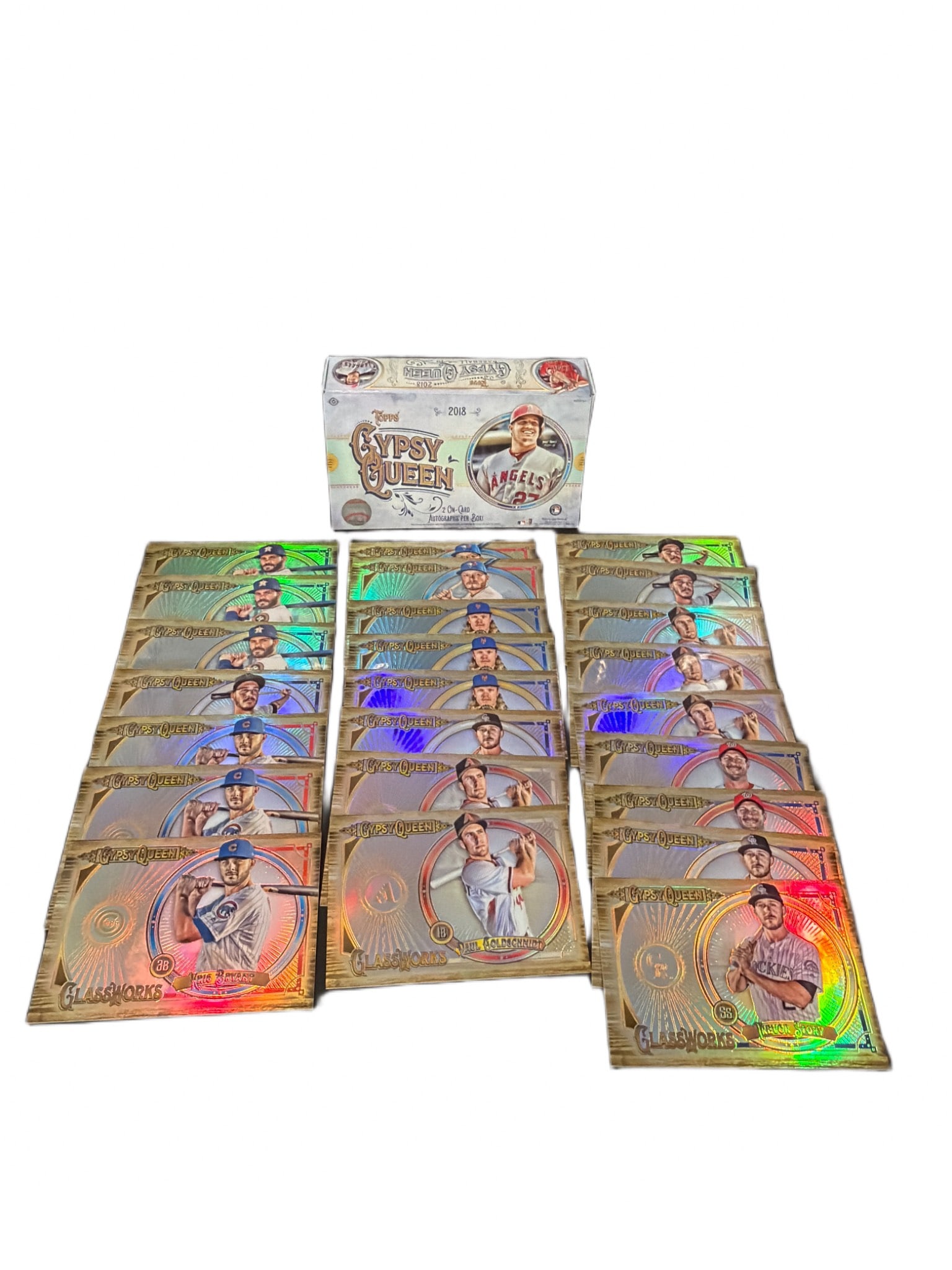 2018 Topps Gypsy Queen Box with 20 Mike Trout Parallel Cards: 2018 Topps Gypsy Queen Baseball card box featuring the cover athlete Mike Trout. The lot includes 20 parallel cards of Mike Trout displayed alongside the box. Dimensions of the cards are shown alongsi