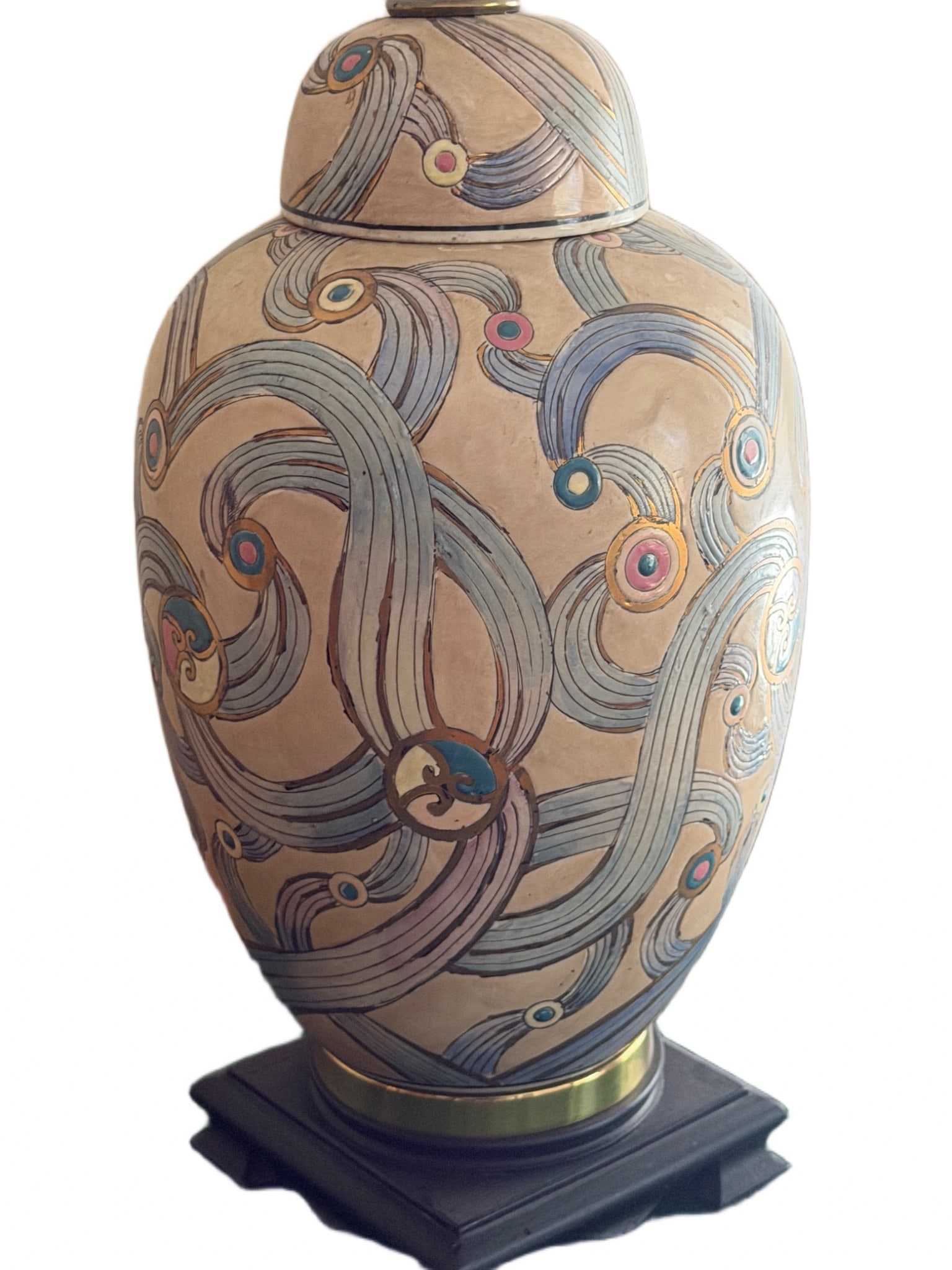 Decorative Table Lamp With Ceramic Base and Fabric Shade: Table lamp featuring a ceramic base with a decorative painted swirl pattern and a fabric lampshade. The lamp includes a brass-tone fitting for the bulb. The overall height of the lamp, including the s