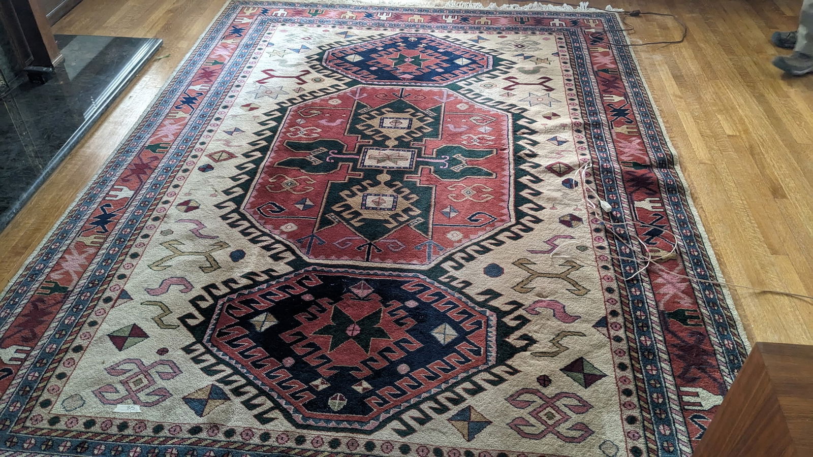 Michael Chandler 8x11 Hand-Knotted Area Rug: Hand-knotted area rug by Michael Chandler, measuring 8 feet by 11 feet. Features a geometric design with multiple colors including red, beige, blue, and black. From the Michael Chandler collection, co