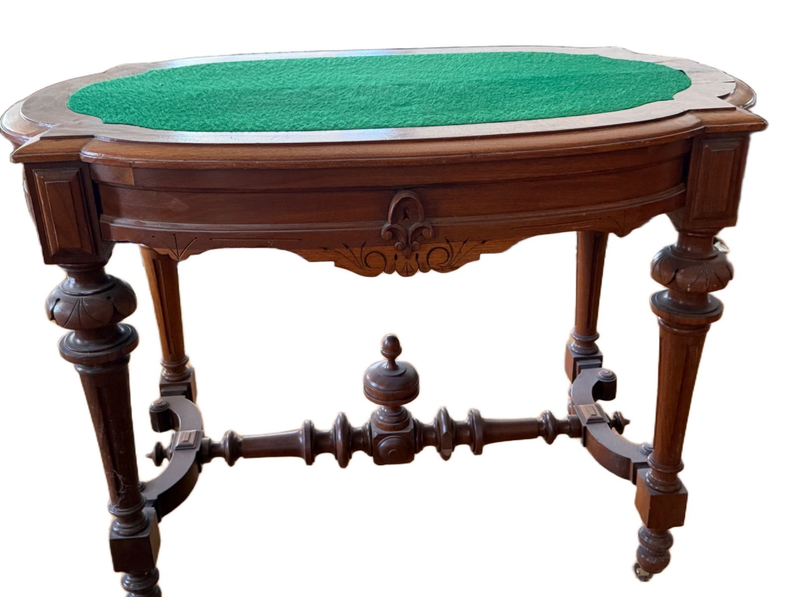 19th Century Walnut Card Table with Green Felt Inlay and Drawer: 19th-century card table crafted from walnut, featuring ornate carved legs and a horizontal support stretcher. The tabletop is finished with a green felt inlay and includes a drawer beneath for storage