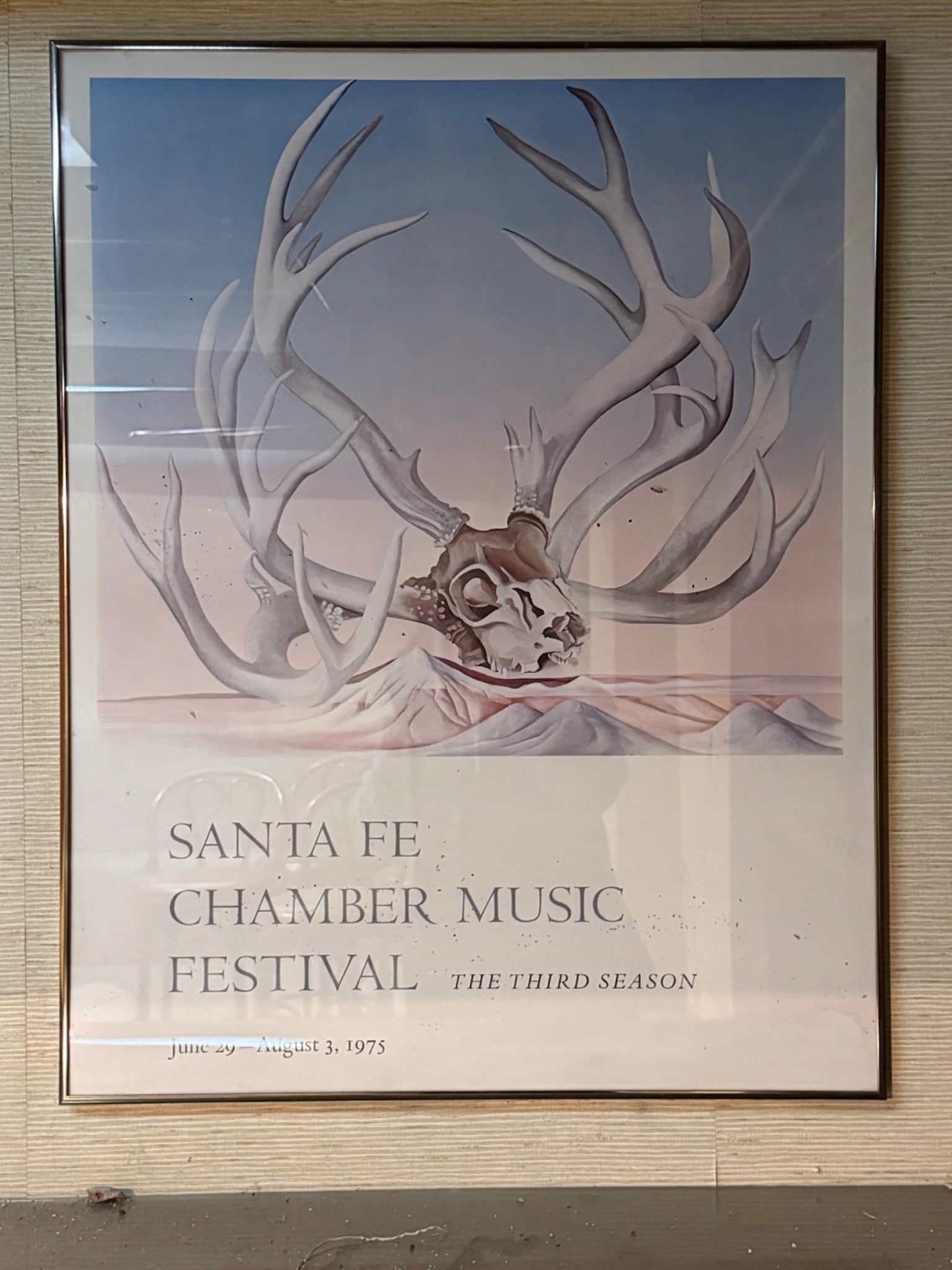 1975 Santa Fe Chamber Music Festival Third Season Poster: Original 1975 poster for the Santa Fe Chamber Music Festival, promoting the event's third season held from June 29 to August 3, 1975. The artwork features a striking design of a deer skull with antler