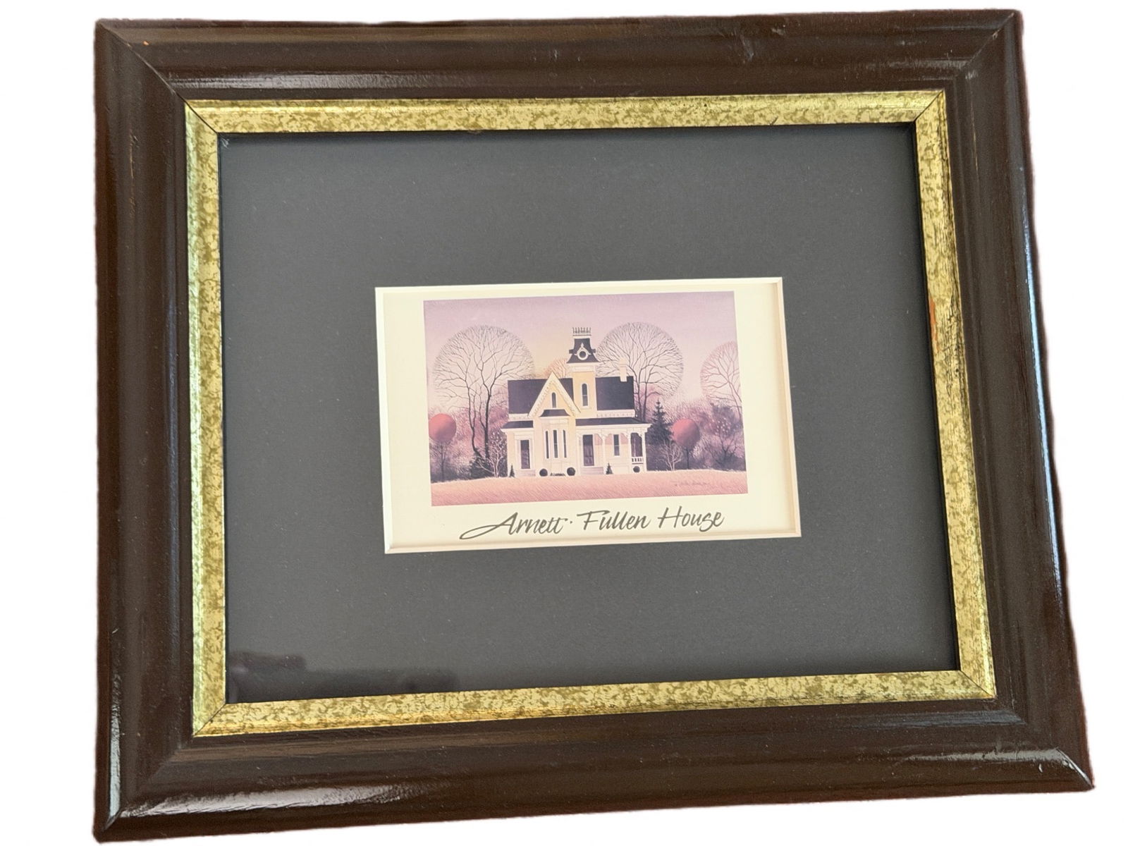 Framed Print of Arnett-Fullen House with Dark and Gold Trim Frame: Framed print depicting the Arnett-Fullen House in a winter setting, featuring muted tones and detailed artwork. The artist's signature is visible. The frame is dark with a gold inner trim and includes