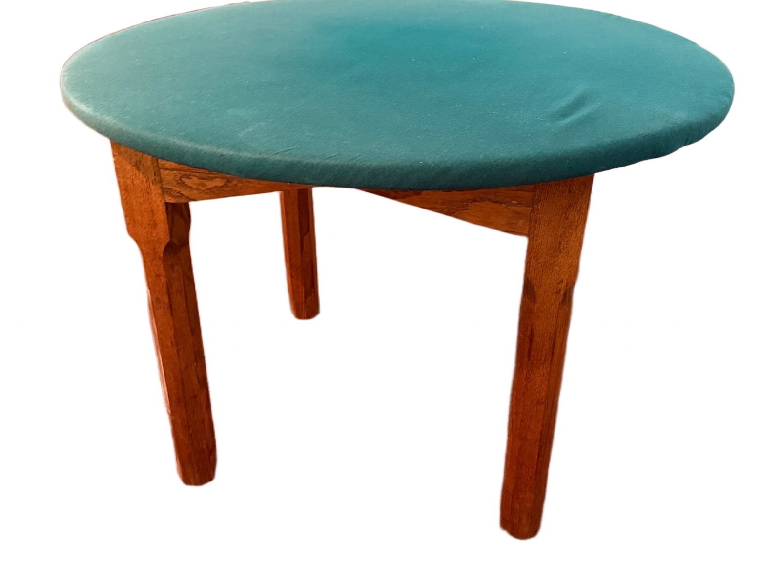 Thomas Electric Round Table with Blue Top and Wooden Legs: Thomas Electric round table featuring a blue upholstered surface and sturdy wooden legs. The label on the underside includes installation instructions, referencing 'Thomas Electric'. The table measure