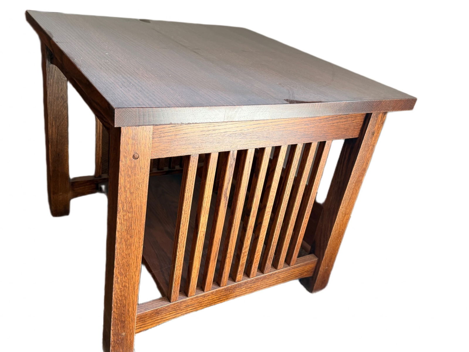 Mission-Style Oak Side Table with Lower Shelf: Mission-style side table constructed from oak, featuring straight lines and vertical slat accents on the sides. Includes a lower shelf for added utility. The measurements are 24 inches in width, 18 in