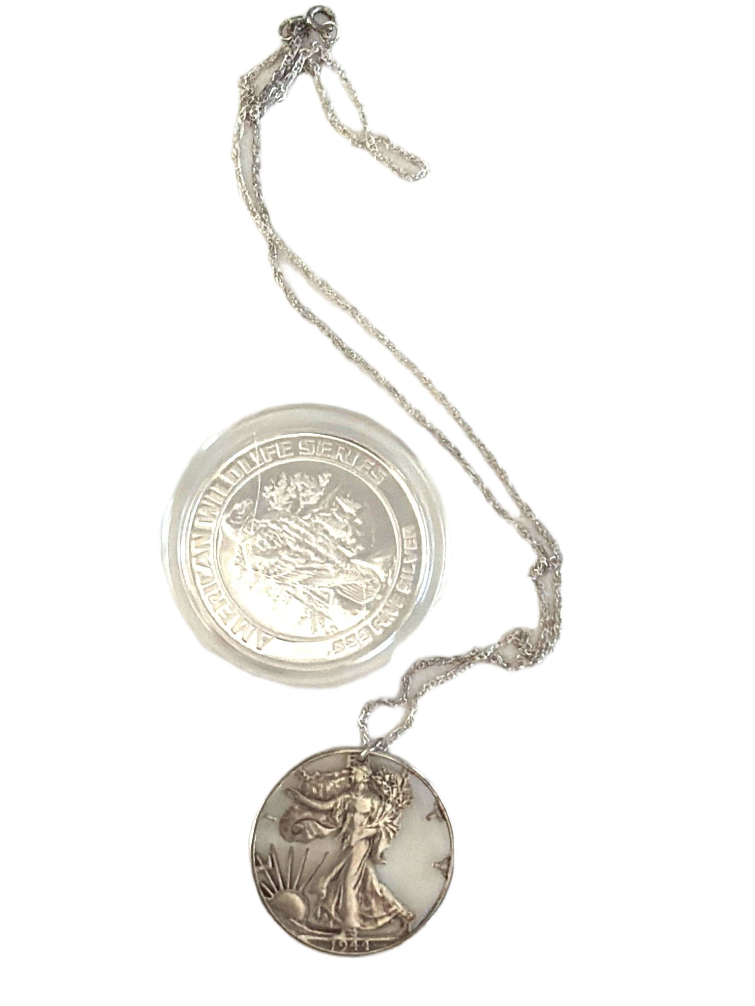 Three .999 Fine Silver Items: American Wildlife Round, Colorado Mining Round, and Walking Liberty: Two .999 fine silver rounds—an American Wildlife Series round featuring an eagle, and a Historic Colorado Mining round depicting a miner and mule—both housed in protective cases. Also included is