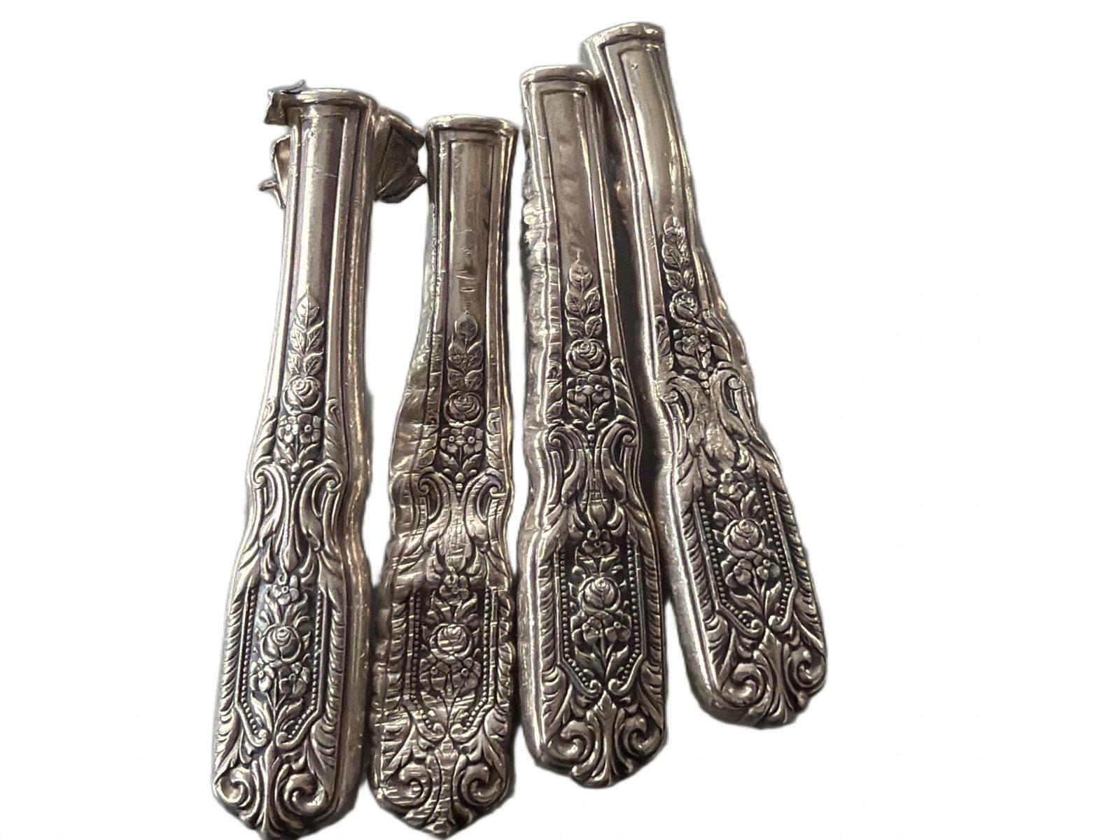 Sterling Silver Knife Handles with Filler, Approx. 100 Grams Total Weight: Sterling silver knife handles with detailed floral designs. The filler weight inside the handles is included in the 100 grams total weight. Some pieces appear detached. Material is not solid silver bu