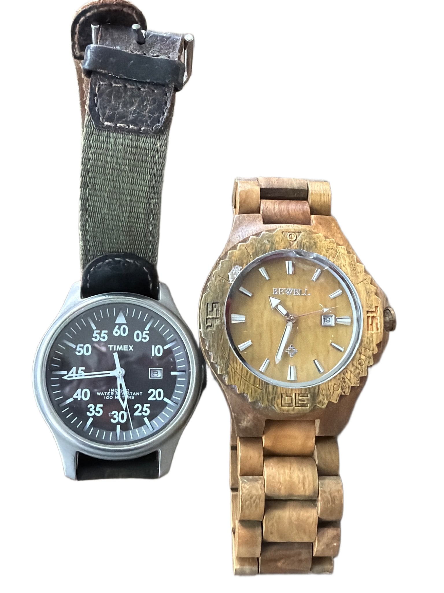 Timex CR2016 Watch and Bewell Wooden Watch with Damage: Two wristwatches: a Timex CR2016 quartz movement model with a stainless steel case, marked WR 100M, and a green fabric strap. The second item is a Bewell wooden watch, featuring a date display and woo